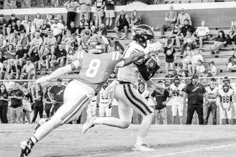 Seminole LB Austin Smith chases down the Tecumseh QB Friday night. Courtesy Photo by Ben Schatzel