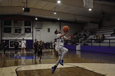Bowlegs Bison Cayxin Parsons breaks away for the easy layup Wednesday. Bowlegs won 82-35 over Graham-Dustin. Staff Photo by Andy Wilson
