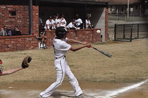 Wewoka Tiger Treven Andrews gets the hit against Strother Friday afternoon. Staff Photo by Bill Anderson