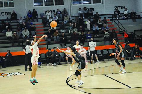 Wewoka Lady Tiger Aubrey Alexander takes a shot from three-point range Thursday night against Bethel. Staff Photo by Bill Anderson
