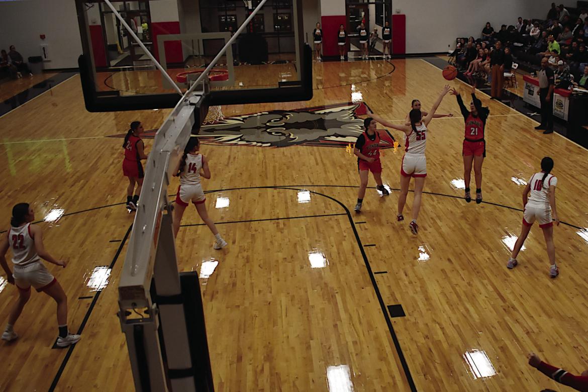 Konawa Lady Tiger Kassidi Lowden shoots from the field over her defender Thursday. Staff Photo by Andy Wilson