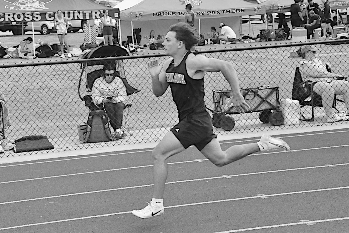 Konawa Tiger Layne Akerman sprints to the finish line in first place in the 100M Friday. Staff Photo by Bill Anderson