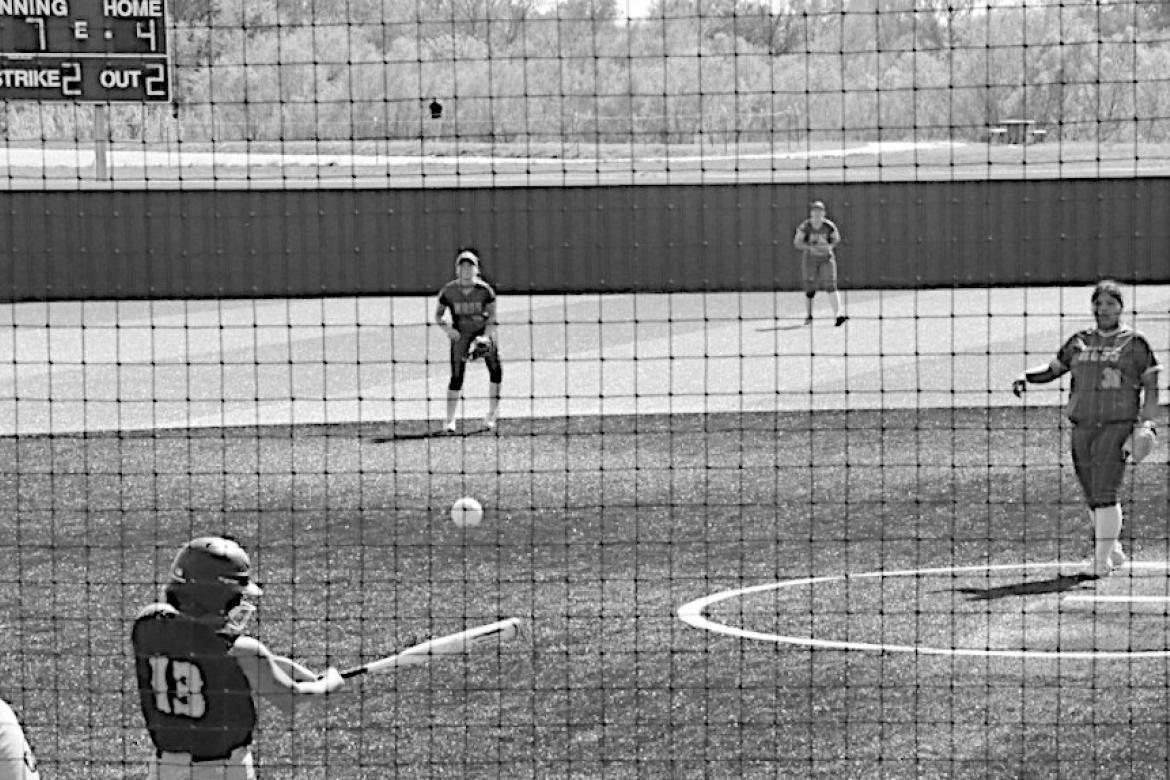 New Lima Falconette Alyssa Marchbanks gets a hold of one and knocks in a runner. Staff Photo by Bill Anderson