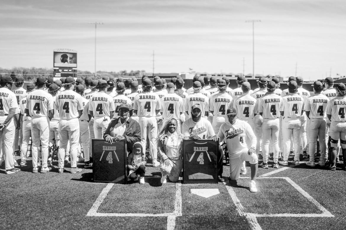 SSC Head Baseball Coach Mack Chambers and members of the Seminole State College baseball team present Denim Harris’ parents, Toy Harper and David Harris, with a framed No. 4 jersey during a jersey retirement ceremony April 4. Harris, an outfielder on th
