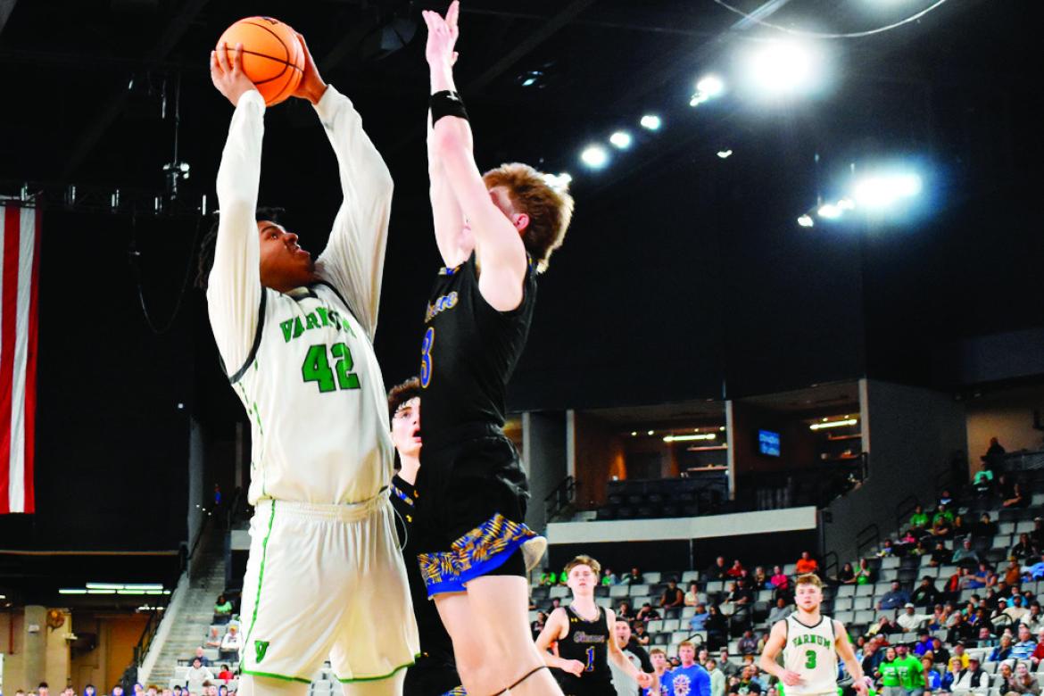 Above, below: Varnum Whippet Jon Madkin and a Glencoe defender battle for the ball underneath the basket at the OG&amp;E Coliseum Thursday evening. The Whippets defeated Glencoe 61-58. —Staff Photos by Andy Wilson