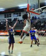 Wewoka Tiger Nadim Bruner flies in for the layup Thursday night. Staff Photo by Bill Anderson