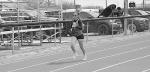Varnum Lady Whippet Makayla Louie runs the first leg of the 4 X 100 Tuesday. Staff Photo by Bill Anderson
