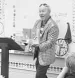 Seminole City Manager Steve Saxon reads the Dr. Seuss classic “Green Eggs and Ham” to Mrs. Marley’s class at Wilson Elementary last week as part of Read Across America Week. The students also made green eggs and ham crafts to take home. —Courtesy 