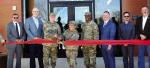 Seminole Natives Brig. Gen. Brad Carter and Col. Lindy White (holding scissors), and Capt. E.J. Johnson, Oklahoma Army National Guard, are joined by Okla. Representative Chris Kannady, Flintco Construction, Larson Design Group, and Oklahoma Army National 