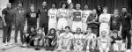 The Wewoka Tiger basketball team holds the plaque for their area consolation victory over Pocola Saturday night. They now advance to the state championship tournament Thursday. —Staff Photo by Andy Wilson